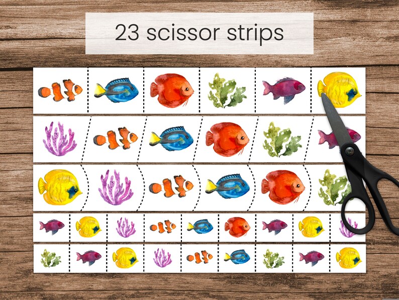 May include: A printable worksheet with 23 scissor strips featuring colorful fish, coral, and seaweed illustrations. The worksheet is titled "23 scissor strips".