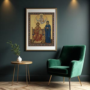 May include: Framed religious icon featuring three figures in a gold-toned background. The central figure is seated, wearing red robes, and holding a book. A woman in blue robes stands to the right. The frame is gold with a decorative border.