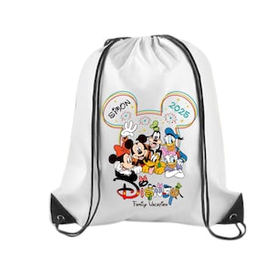 May include: White drawstring bag featuring a colorful Disney graphic. The design includes Mickey and Minnie Mouse, Goofy, and Donald Duck. The text "SIMON 2025" is displayed in a Mickey Mouse ear shape, with "Disney Family Vacation" below.
