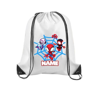 May include: White drawstring backpack featuring a blue spiderweb design with four cartoon Spider-Man characters. The word "NAME" is printed in red on a white background. The bag has black drawstrings and black reinforced corners.