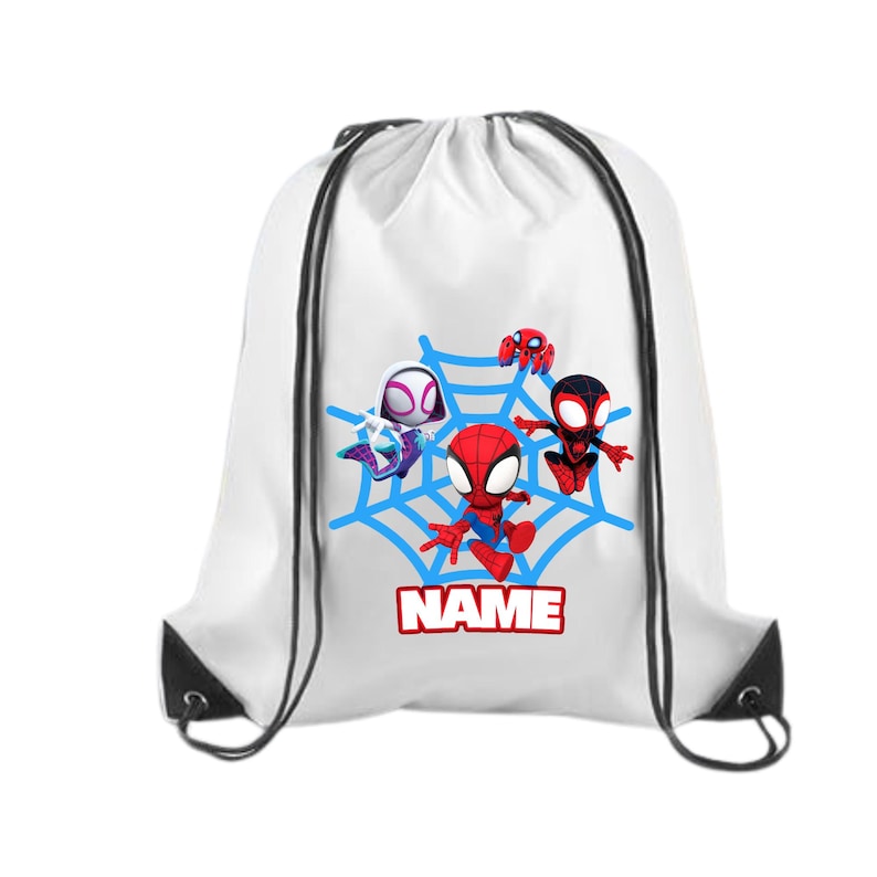 May include: White drawstring backpack featuring a blue spiderweb design with four cartoon Spider-Man characters. The word "NAME" is printed in red on a white background. The bag has black drawstrings and black reinforced corners.