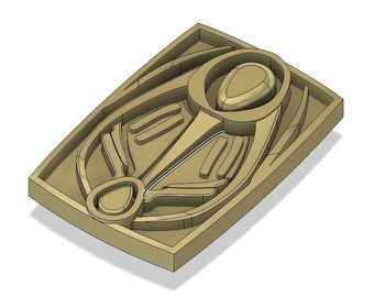 May include: A 3D printed mold for casting a decorative object. The mold is made of a light brown plastic and has a detailed design. The mold is shaped like a stylized bird with a large, round head and a long, thin beak.