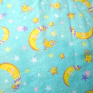 Aqua moon & stars Kid Flannels remnant 26x40 and one fat quarter. Aqua w man in the moon stars, nice and soft