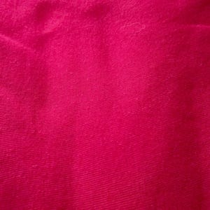 May include: Close-up of a vibrant, solid magenta fabric. The textile has a slightly textured appearance with subtle diagonal lines, creating a sense of depth and visual interest. The color is rich and saturated.