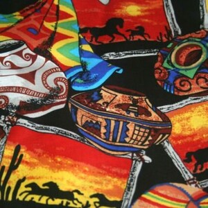 May include: A colorful fabric with a southwestern design featuring horses, pottery, and geometric patterns. The fabric is primarily black with red, orange, yellow, blue, and green accents.
