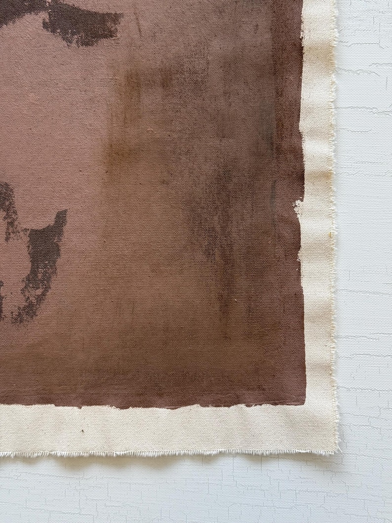 May include: Abstract artwork on canvas featuring shades of brown and tan. The painting has a raw, unfinished edge with visible canvas texture. The color palette includes deep browns and lighter tan hues, creating a textured, earthy aesthetic.
