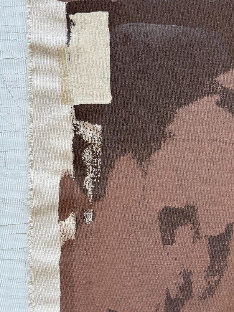 May include: Abstract art canvas with a raw edge. The artwork features a palette of brown, beige, and off-white brushstrokes. The canvas has a textured appearance, with visible paint application and a raw, unfinished edge.