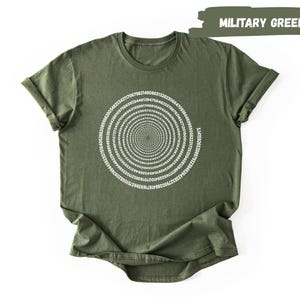 A military green t-shirt with a spiral design on the front.