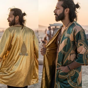 May include: A reversible kimono-style robe featuring a metallic gold fabric on one side with a central embroidered detail and a dark green fabric on the reverse side, which is decorated with a repeating tan and gold ornate circular pattern.