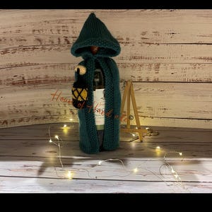 The Hooded Cloak with Lantern Wine Bottle Cover Knitting Pattern