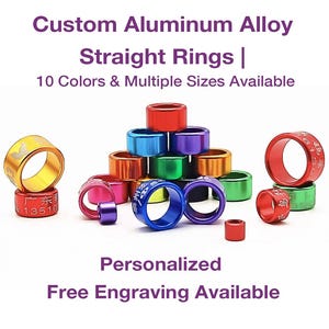 May include: A collection of colorful aluminum alloy straight rings in various colors, including red, blue, and green. The rings have text and designs on them. The image also includes the text "Custom Aluminum Alloy Straight Rings | 10 Colors & Multiple Sizes Available" and "Personalized Free Engraving Available."
