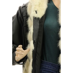 May include: A black leather jacket with a white fur collar and lining. The jacket has a zipper closure and a belt.