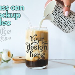 May include: A glass can mockup with a black and white polka dot jug pouring milk into the can. The can has the text "Your design here" on it.