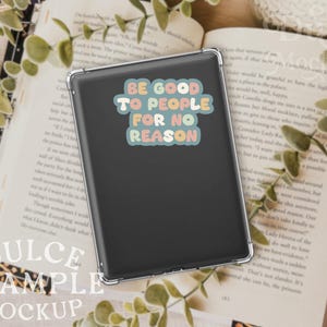 May include: A black phone case with a sticker that reads "Be good to people for no reason". The sticker has a retro, colorful design.