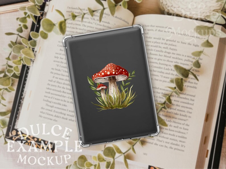 May include: A black phone case with a watercolor illustration of red and white mushrooms with green leaves on a dark gray background.