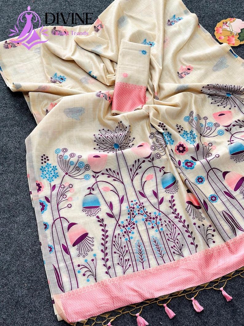 Floral linen saree pastel color Indian saree
Designer saree with printed pallu tassels
Soft cotton linen saree elegant floral design
Traditional Indian saree modern pastel style
Lightweight festive saree with blouse piece