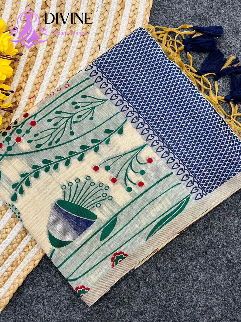 Floral linen saree pastel color Indian saree
Designer saree with printed pallu tassels
Soft cotton linen saree elegant floral design
Traditional Indian saree modern pastel style
Lightweight festive saree with blouse piece