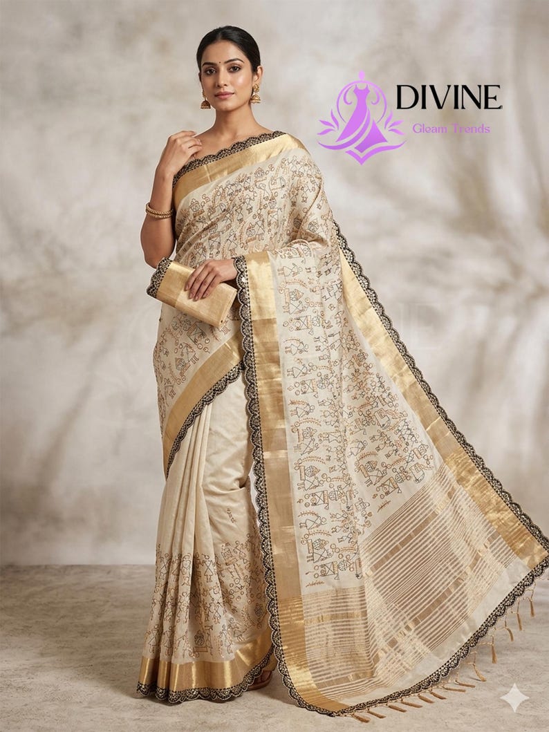 May include: Cream-colored sari with gold borders and black lace trim. The sari features a repeating pattern of small figures and shapes. A matching clutch is held in the model's hand. The Divine Gloom Trends logo is visible in the upper right corner.