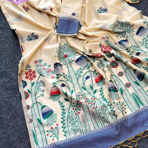 Floral linen saree pastel color Indian saree
Designer saree with printed pallu tassels
Soft cotton linen saree elegant floral design
Traditional Indian saree modern pastel style
Lightweight festive saree with blouse piece