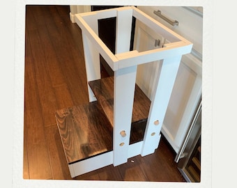 May include: White wooden step stool with two steps. The top step is unfinished wood and the bottom step is painted white.