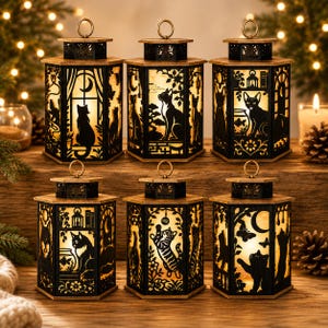 May include: Six hexagonal lanterns featuring intricate black laser-cut panels with various cat silhouettes, including cats sitting by windows, playing with hanging ornaments, and near fishbowls. Each lantern has a warm internal light and a top ring.