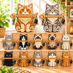 May include: A collection of twelve wooden cat-shaped key holders, each featuring a cat holding a fish skeleton in its mouth. The cats vary in color, including orange, gray tabby, black, white, and calico, with metal hooks for hanging keys.