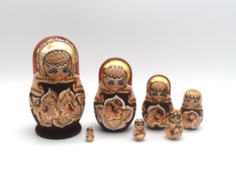 Matryoshka made of wood with gold painting, probably handmade in the 70s