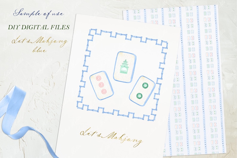 May include: A white card with a blue border and a blue and green illustration of mahjong tiles. The text "Let's Mahjong" is written in gold script on the card.