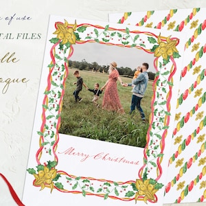 May include: A Christmas card with a red, green, and gold border featuring a family of four standing in a field. The card says "Merry Christmas" in red cursive.