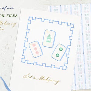 May include: A white card with a blue border and a blue and green illustration of mahjong tiles. The text "Let's Mahjong" is written in gold script on the card.