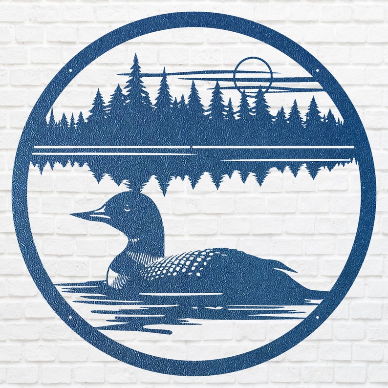 May include: A blue metal wall art piece featuring a loon swimming on a lake, with a forest and sun in the background. The artwork is circular and mounted on a white brick wall.