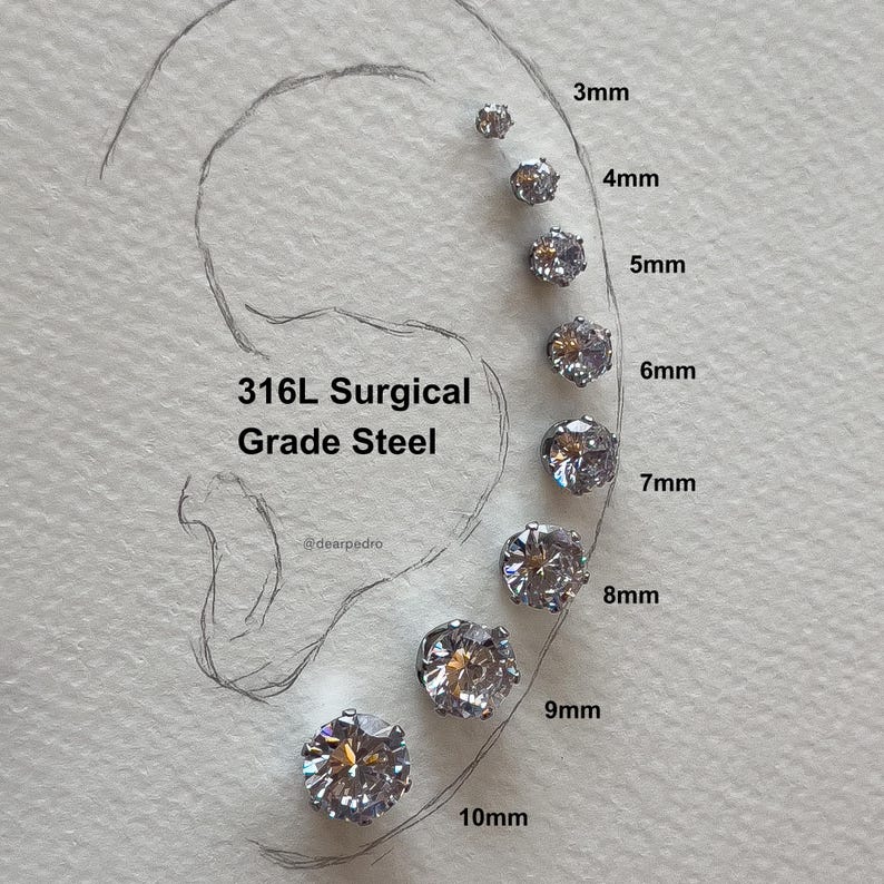 Visual size chart of cubic zirconia stud earrings (3mm to 10mm) displayed on an ear outline, crafted from 316L surgical grade steel, hypoallergenic, with a brilliant diamond-like sparkle