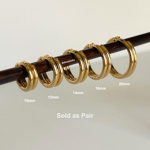 Gold 316L stainless steel hinged hoop earrings displayed on rod with sizes 10mm, 12mm, 14mm, 16mm, and 20mm, sold as a pair, minimalist stackable hoops.