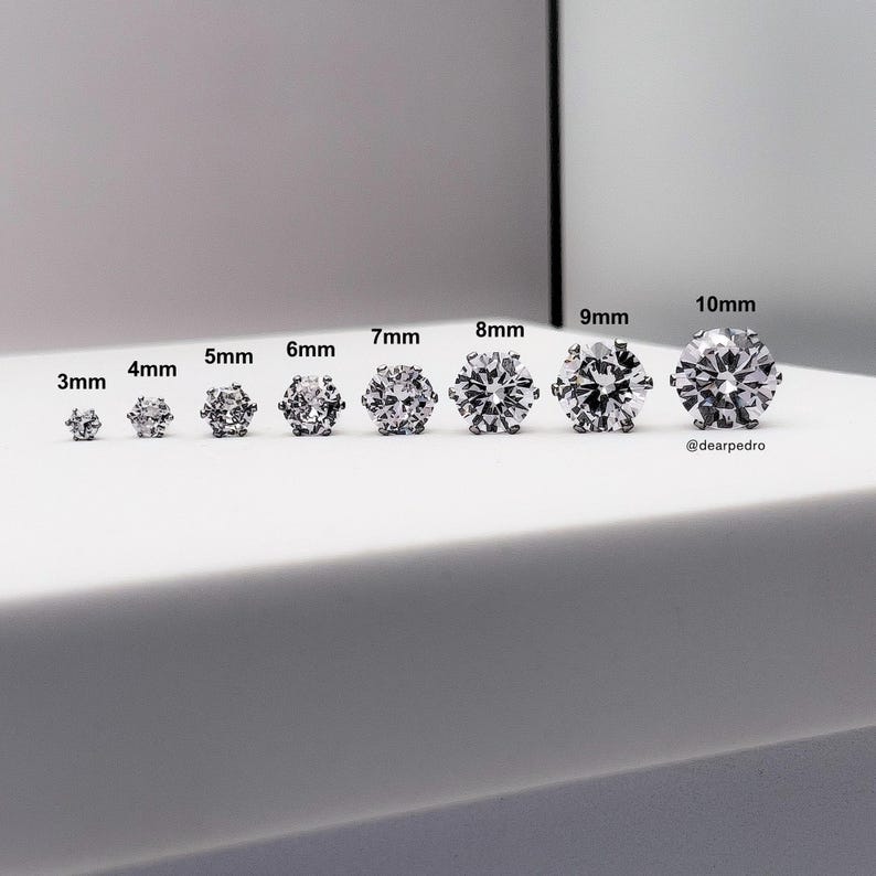 Size comparison of cubic zirconia stud earrings in 3mm to 10mm, crafted from 316L surgical grade steel, hypoallergenic and perfect for sensitive ears, showcasing brilliant diamond-like sparkle