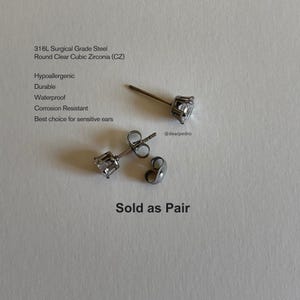 Round clear cubic zirconia stud earrings crafted from 316L surgical grade steel, hypoallergenic, durable, waterproof, and corrosion-resistant; sold as a pair, ideal for sensitive ears
