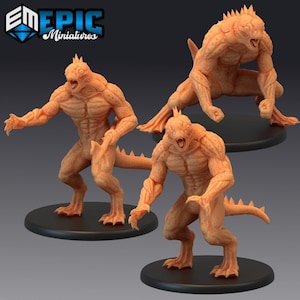 May include: Three 3D printed miniatures of humanoid lizard creatures with sharp claws and teeth. The creatures are in a fighting stance with their mouths open and their claws extended. The miniatures are painted in a light orange colour.