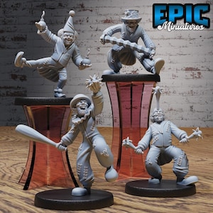 May include: Four grey painted miniature figurines of clowns with different weapons. The clowns are wearing tattered clothing and have exaggerated features. The figurines are posed on black bases and are displayed on red and grey stands. The text "EPIC Miniatures" is visible in the upper right corner of the image.