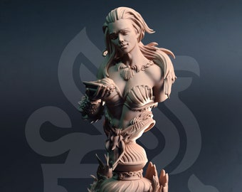 May include: A detailed bust sculpture of a woman with long flowing hair, wearing a seashell bra and a necklace. The sculpture is made of a light brown material and is set on a base with seashells and other marine life.