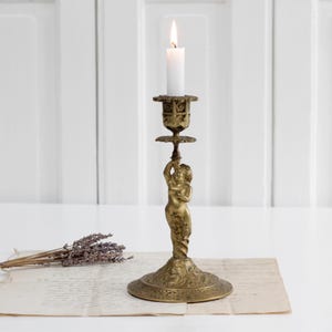 Antique French Art Nouveau bronze candle holder with angel sculpture, vintage ornate brass putti cherub candelabra, gold tone candlestick