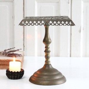 Antique Art Nouveau brass fireside trivet, reticulated pedestal kettle pot holder, footed pan stand, pierced footman, warmer, riser