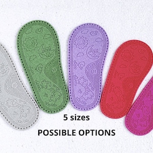 May include: Five different coloured leather baby shoe soles with a sun, moon, and owl design. The soles are available in five sizes.