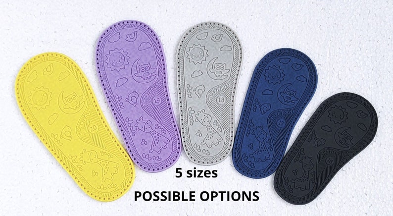 May include: Five pairs of colourful baby shoe soles featuring a giraffe and moon design. The soles are made from a soft, flexible material and are available in five sizes.