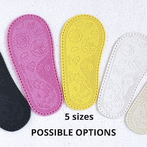May include: Five pairs of colourful shoe soles with a whimsical design featuring a sun, moon, clouds, and an owl. The soles are made of a textured material and are available in black, pink, yellow, white, and beige.