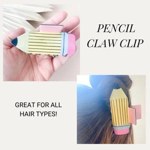 K&ouml;nnte beinhalten: Eine gelbe und rosafarbene Haarklammer in Form eines Bleistifts. Die Klammer hat schwarze Linien und einen rosa Radiergummi. Der Text "PENCIL CLAW CLIP" ist in Wei&szlig; auf schwarzem Hintergrund geschrieben. Der Text "GREAT FOR ALL HAIR TYPES!" ist in Schwarz auf wei&szlig;em Hintergrund geschrieben.