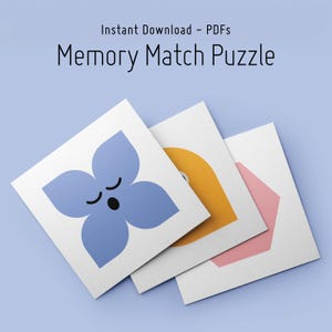 May include: Three white square cards with colorful shapes and the text "Memory Match Puzzle" are displayed on a light blue background. The cards feature a blue flower, a yellow circle, and a pink hexagon. The text "Instant Download - PDFs" is above the title.
