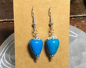 Turquoise colored beaded drop earrings in silver