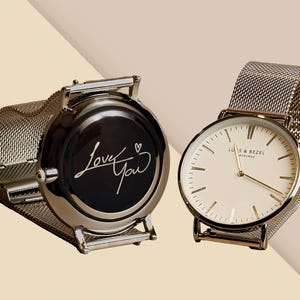 a couple of watches sitting next to each other