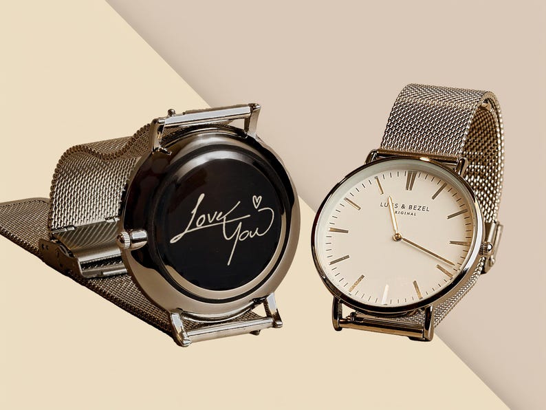 a couple of watches sitting next to each other