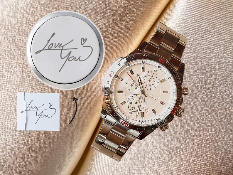 a watch sitting on top of a piece of paper