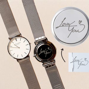 a couple of watches sitting next to each other